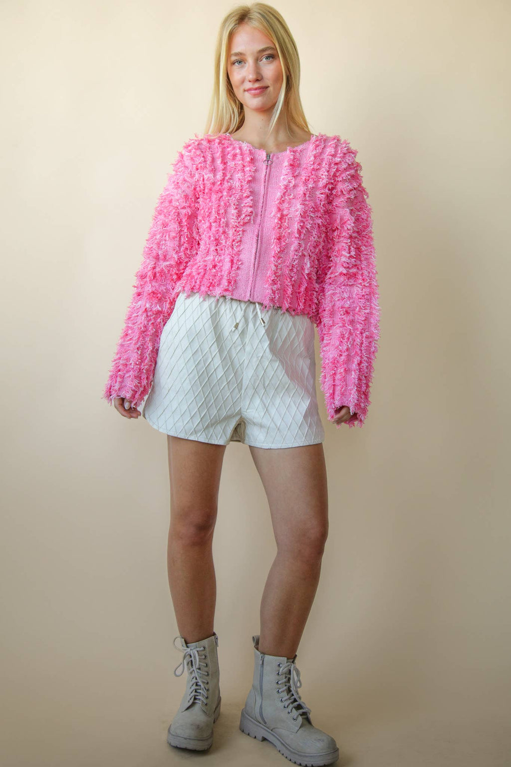 Bella’s pink textured zip sweater.