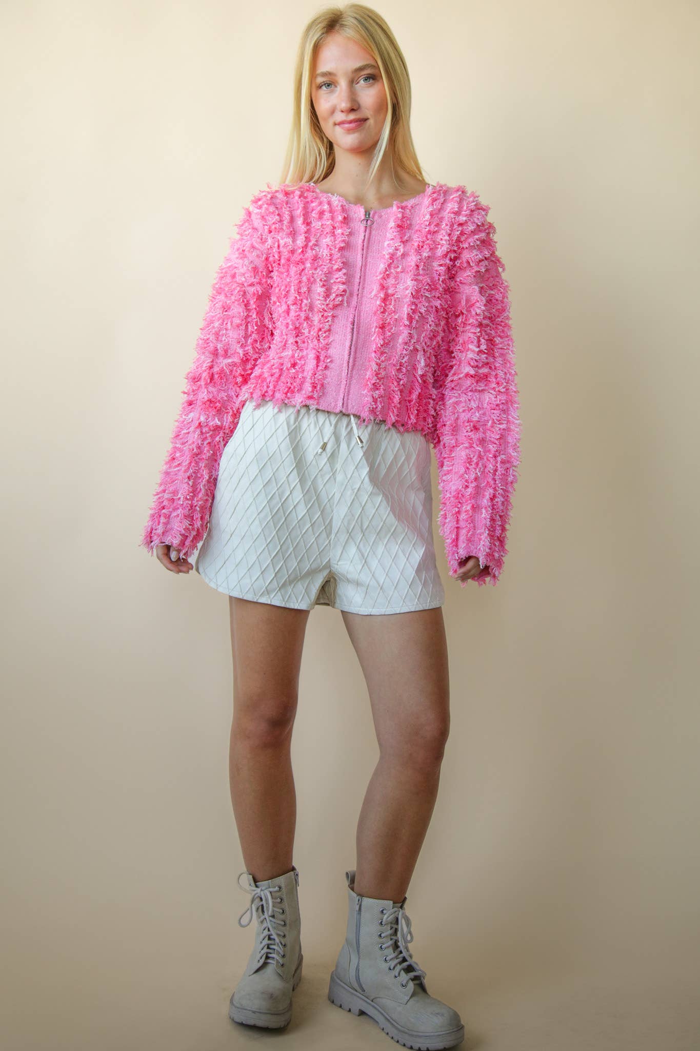 Bella’s pink textured zip sweater.