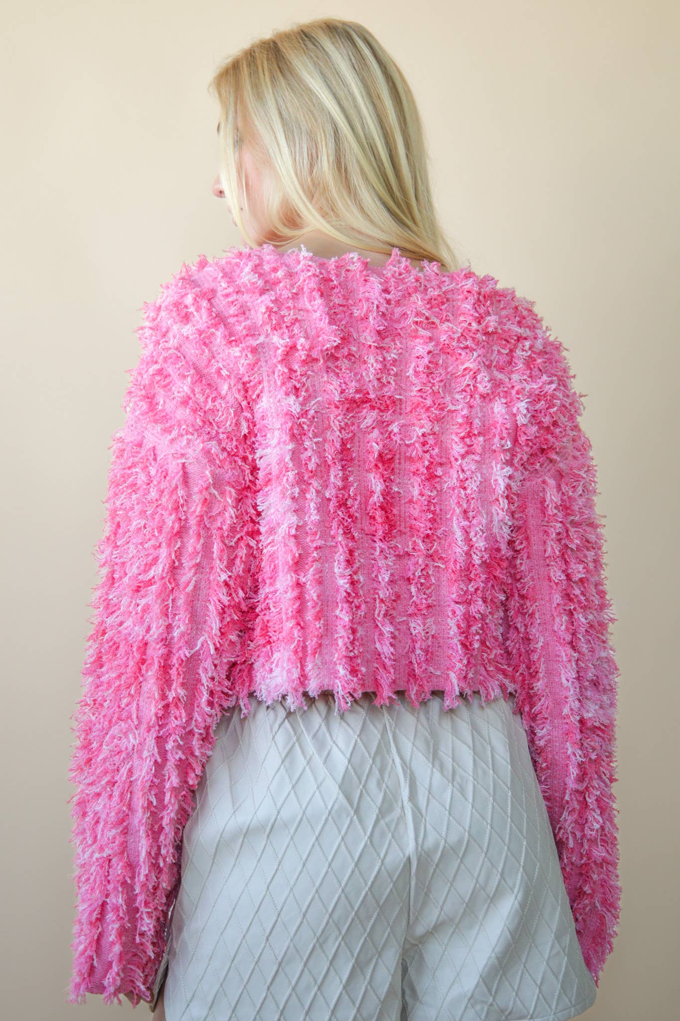 Bella’s pink textured zip sweater.