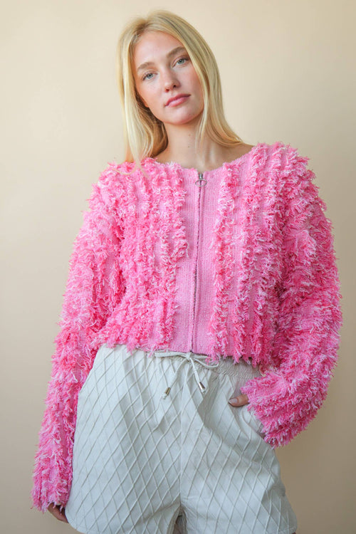 Bella’s pink textured zip sweater.
